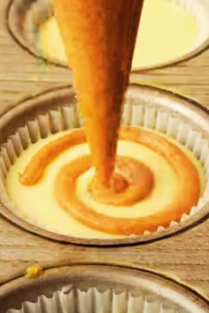 Electric mixer beating cream cheese to perfect consistency